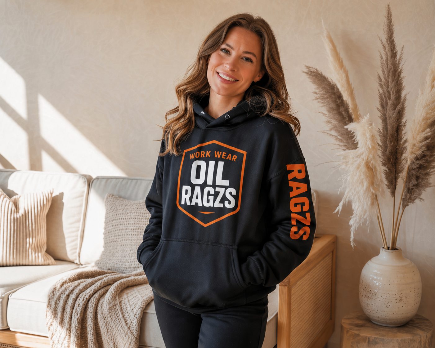 Woman wearing black Oil Ragzs hoodie at home
